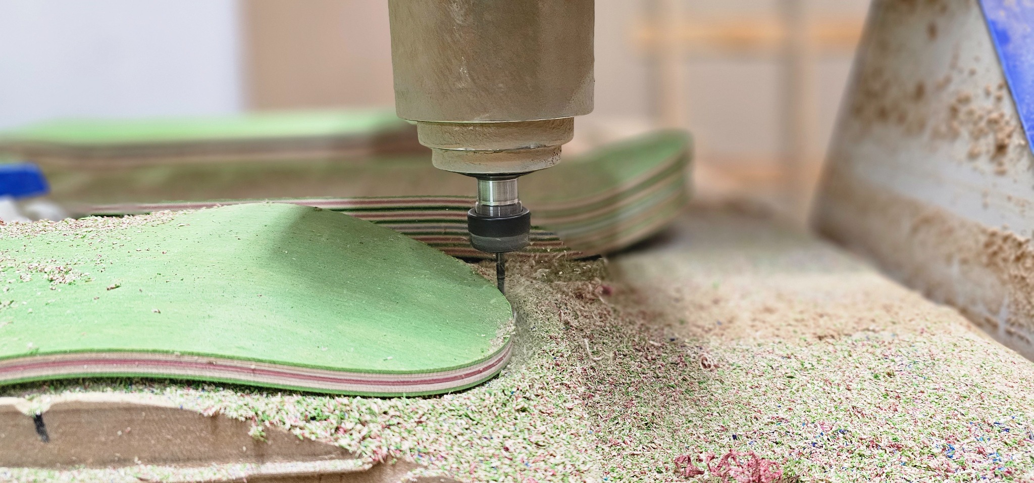 CNC trimming stacked skateboard decks